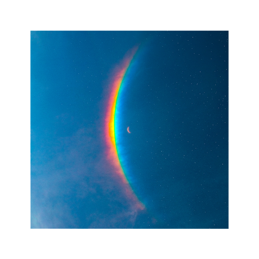 The Moon Music artwork features a crescent moon in the center, with a large, arced rainbow light dispersion to the left. The colors created by the light dispersion flow from red to orange, yellow, green, light&dark blue, on a blue sky filled with stars.