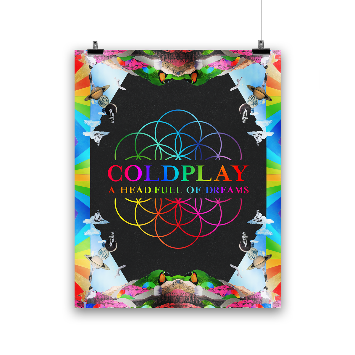 Image 1:
The poster features the flowerOfLife in the center, with intertwined circles as blue, green, yellow, orange, pink&purple petals; the band appear as kids: Phil sits on a white fluffy☁️Chris sits on the moon, Jonny hangs from Saturn’s rings, Will jumps into a swimming pool, and Guy holds his baby brother. Mirrored mountains grace the edges. There are planets, astronauts, rainbow stripes,& a toucan with a bright yellow chest, black head&beak, and an orange face. The illustrations form a kaleidoscope